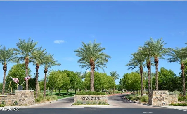 a living room with furniture a rug and a chandelier