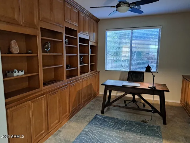 a view of a workspace with furniture