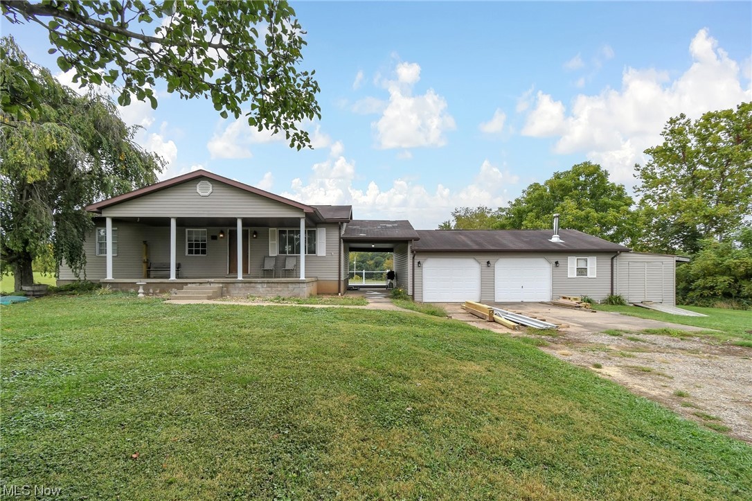 681 Rocky Point Road Fleming, OH 45729 - Photo 2 of 33 Ranch-style home with a front lawn and a porch