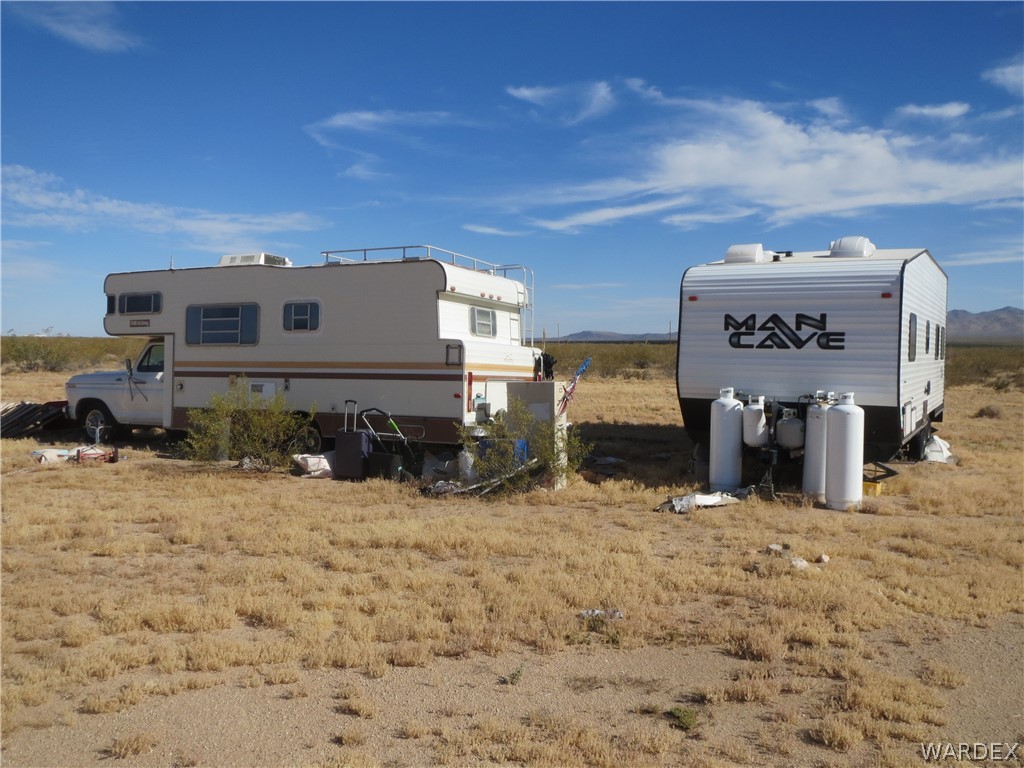 19157 Doc Holliday Road Yucca, AZ 86438 - Photo 10 of 14 a view of a house with a yard