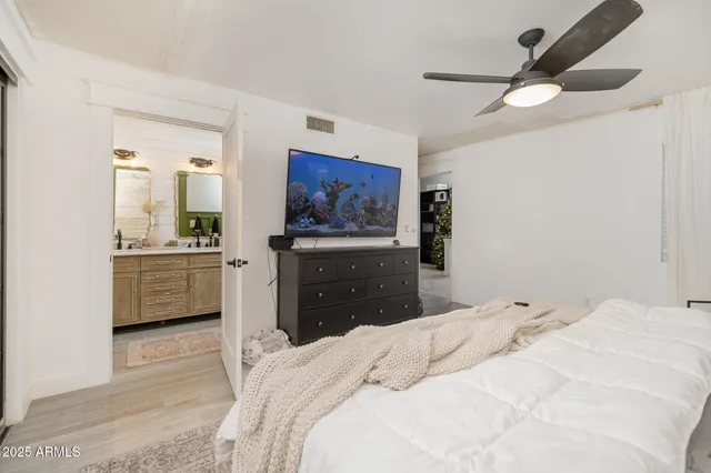 a bedroom with a bed and a dresser