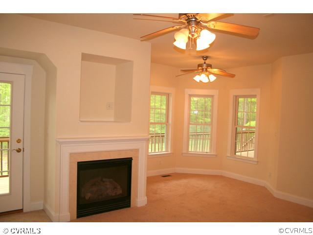 1024 Schroeder Road Powhatan, VA 23139 - Photo 17 of 24 Bedroom - The bay window, fireplace, and seating a