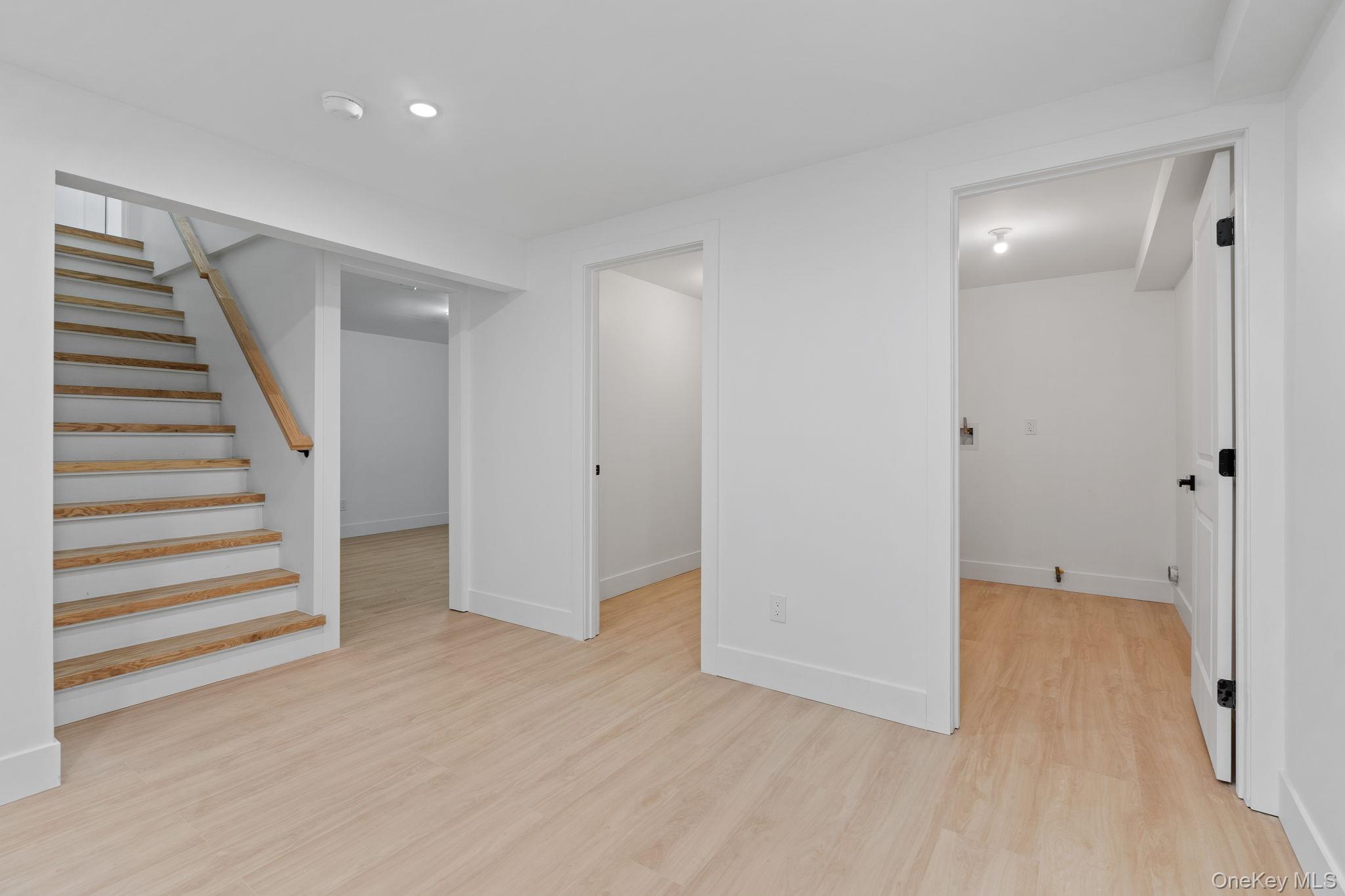 52 Rudolph Road Modena, NY 12548 - Photo 33 of 49 Basement featuring light wood-type flooring and stairway