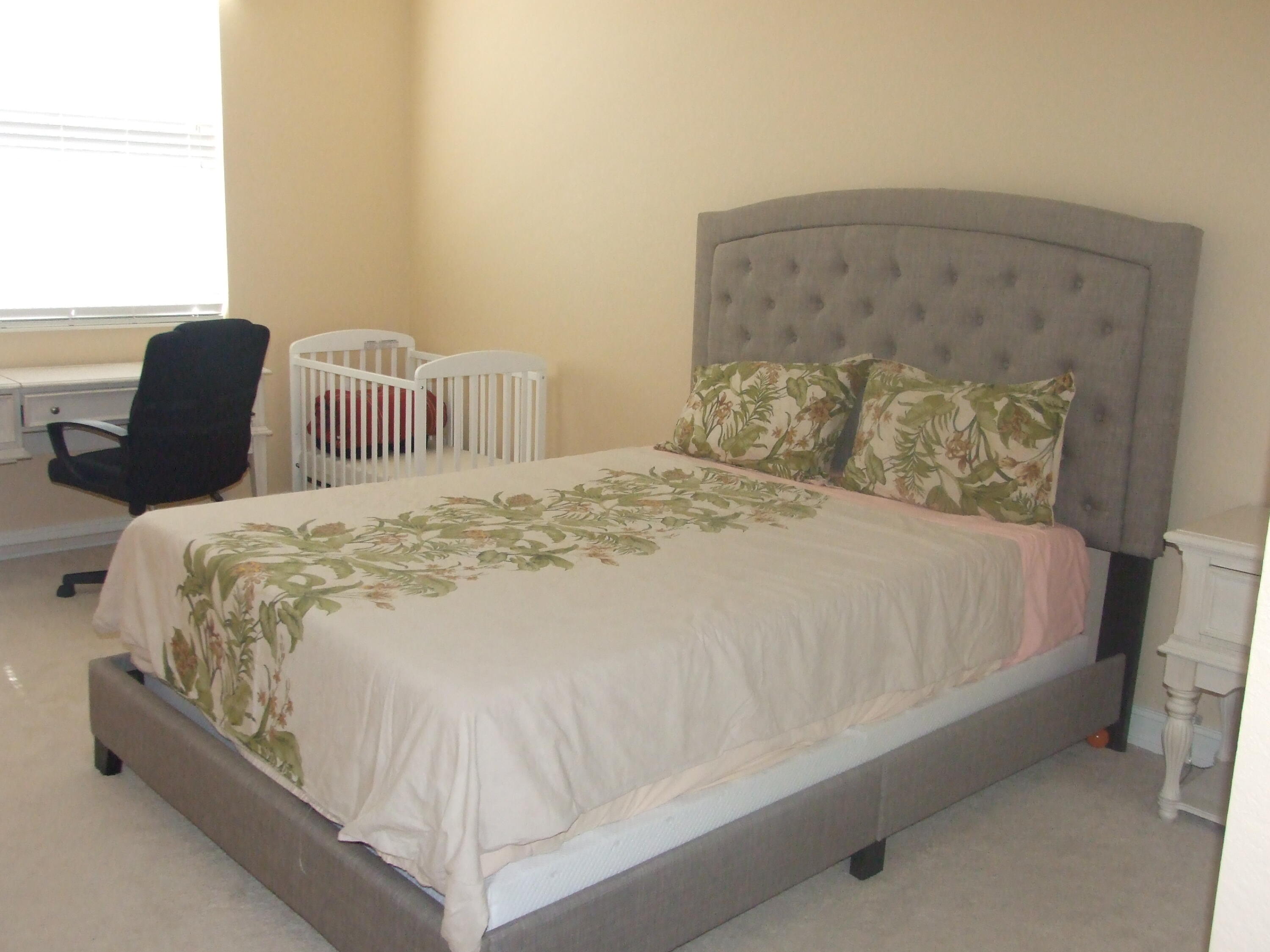 1000 North Us Highway West, Unit 809 Jupiter, FL 33477 - Photo 12 of 21 a large bed sitting in a bedroom next to a window