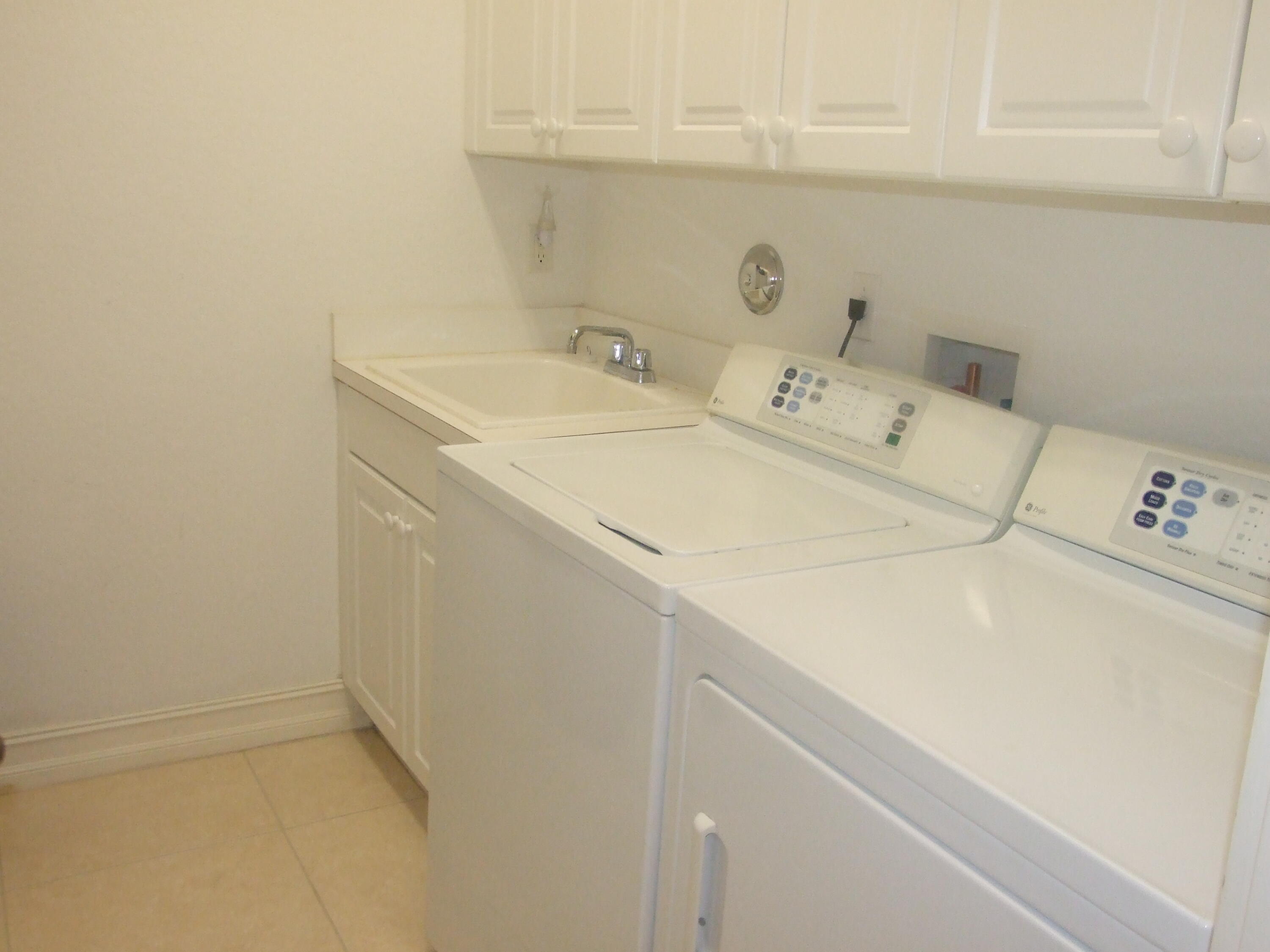 1000 North Us Highway West, Unit 809 Jupiter, FL 33477 - Photo 14 of 21 a utility room with dryer and washer