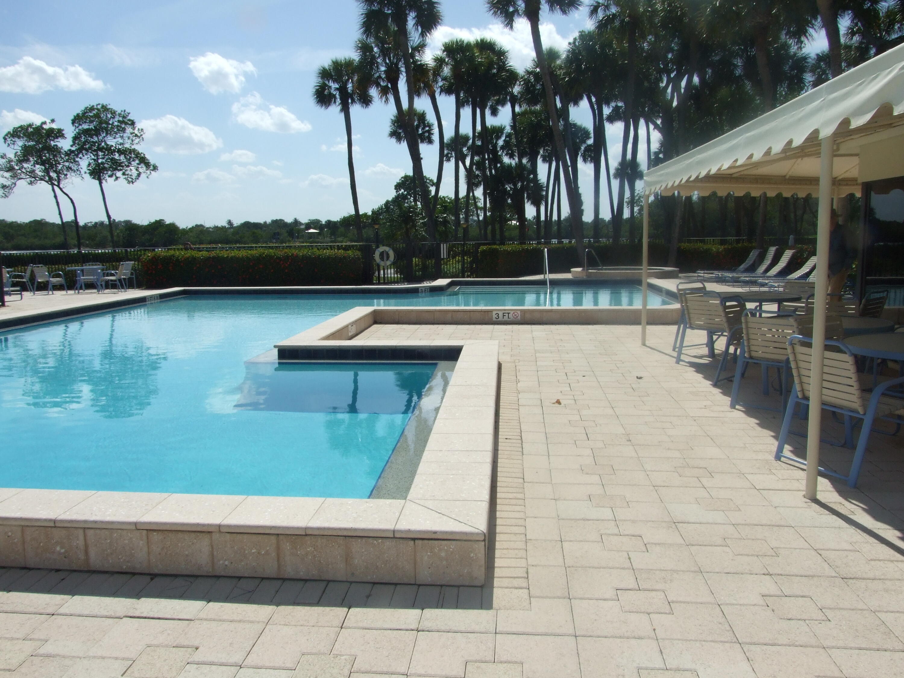 1000 North Us Highway West, Unit 809 Jupiter, FL 33477 - Photo 18 of 21 a view of swimming pool with chairs