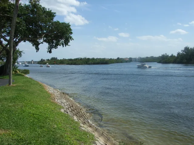 a view of a lake with houses in the back