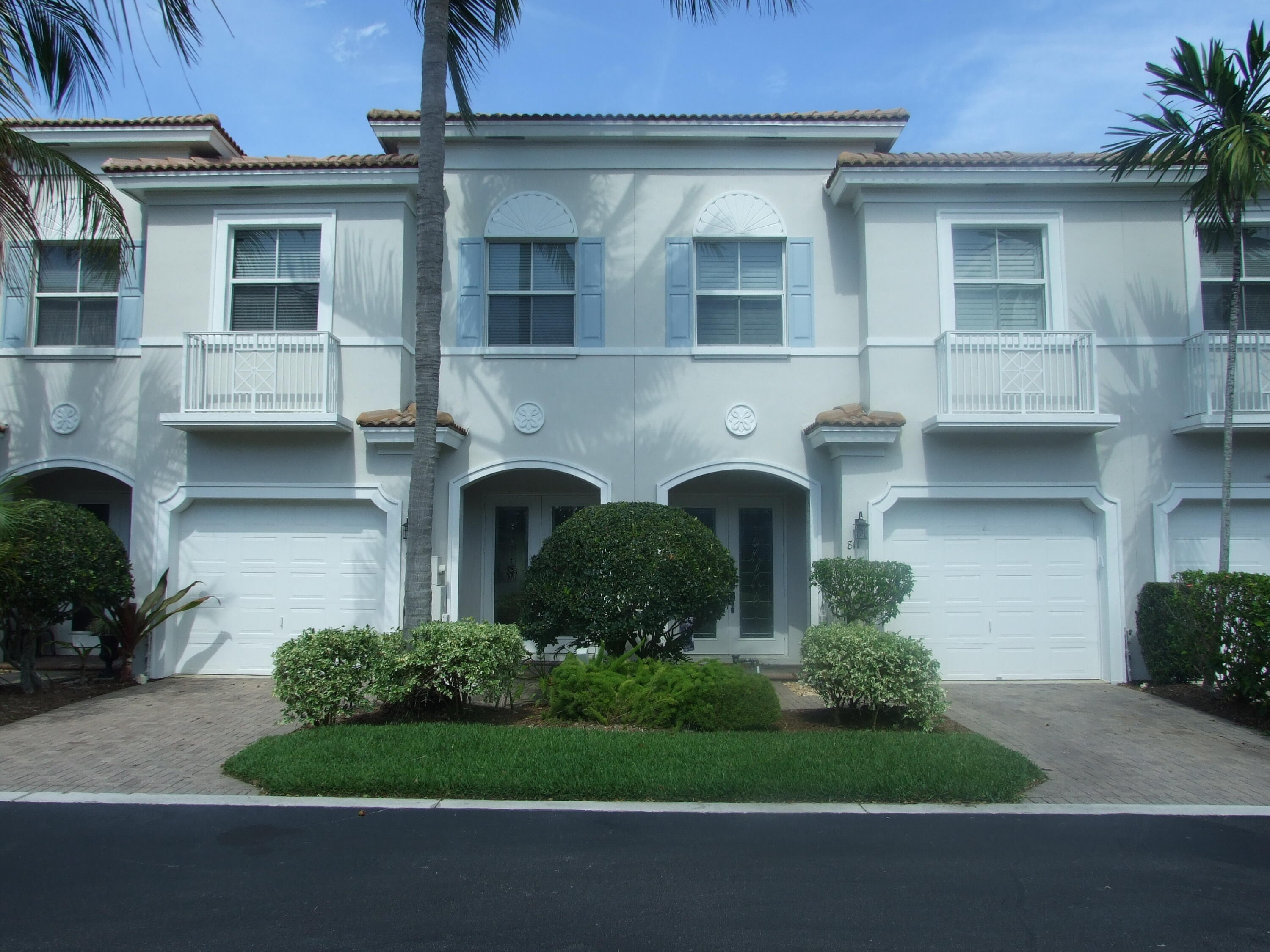1000 North Us Highway West, Unit 809 Jupiter, FL 33477 - Photo 2 of 21 a front view of a house with garden