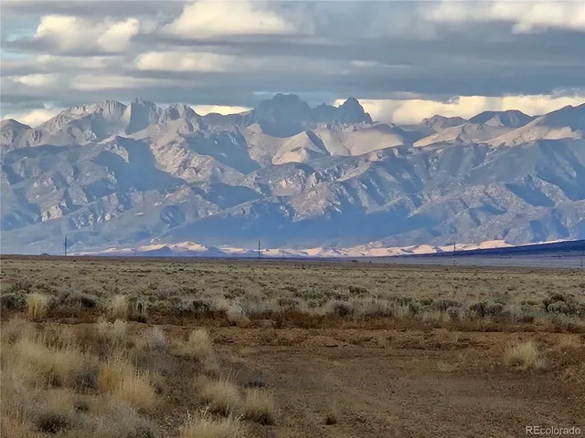 a view of a yard with a mountain