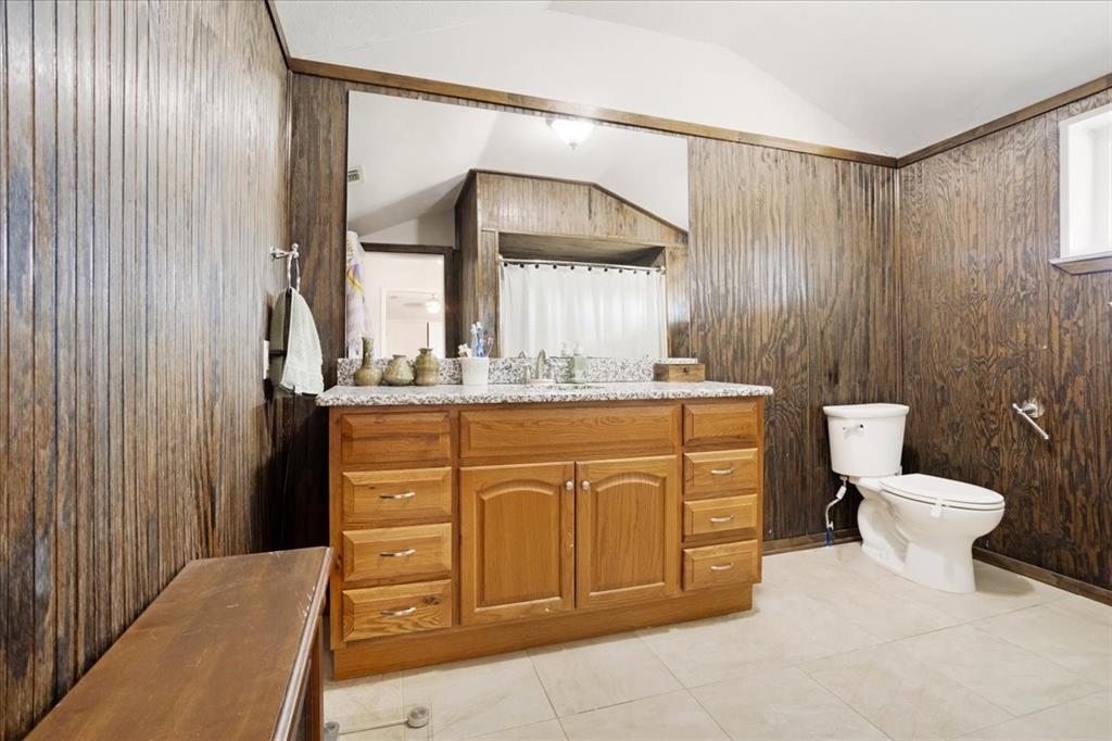 90 Williams Trail Howe, TX 75459 - Photo 14 of 18 a bathroom with a sink a toilet and a mirror