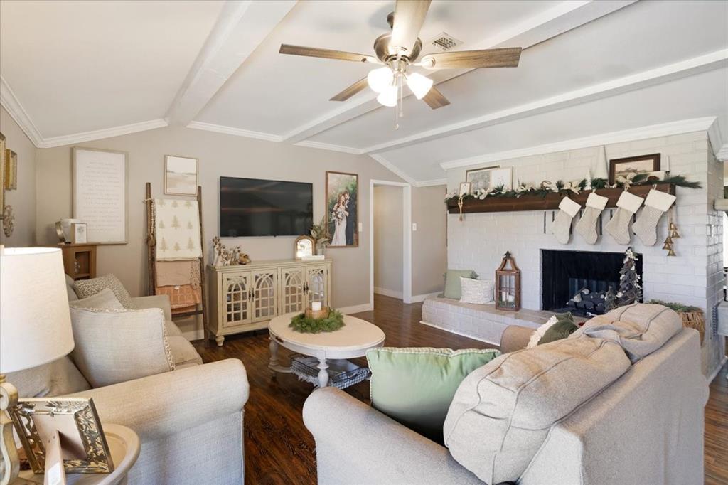 90 Williams Trail Howe, TX 75459 - Photo 8 of 18 a living room with furniture a fireplace and a flat screen tv