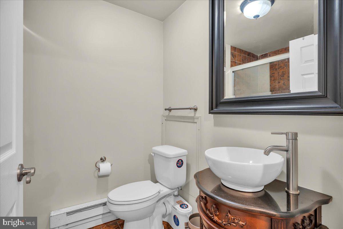 48 Country Club Road Pine Hill, NJ 08021 - Photo 32 of 40 a bathroom with a toilet and a sink