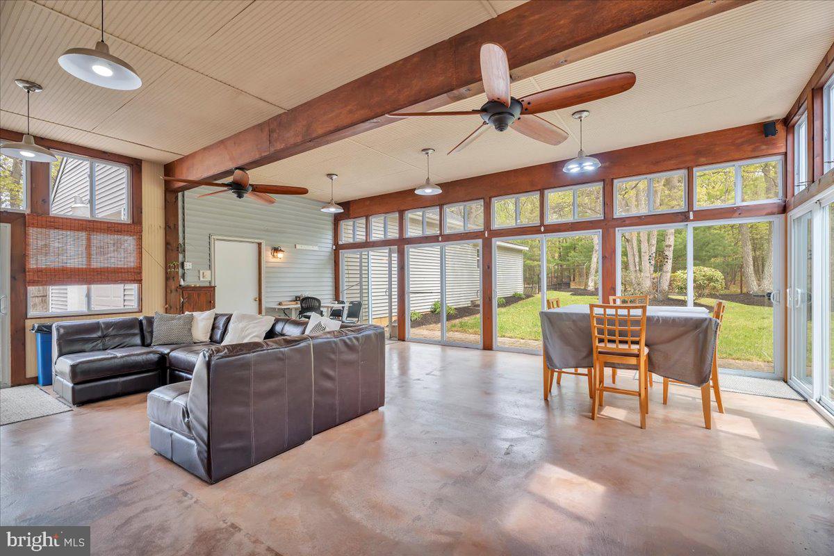48 Country Club Road Pine Hill, NJ 08021 - Photo 33 of 40 a living room with furniture and a floor to ceiling window