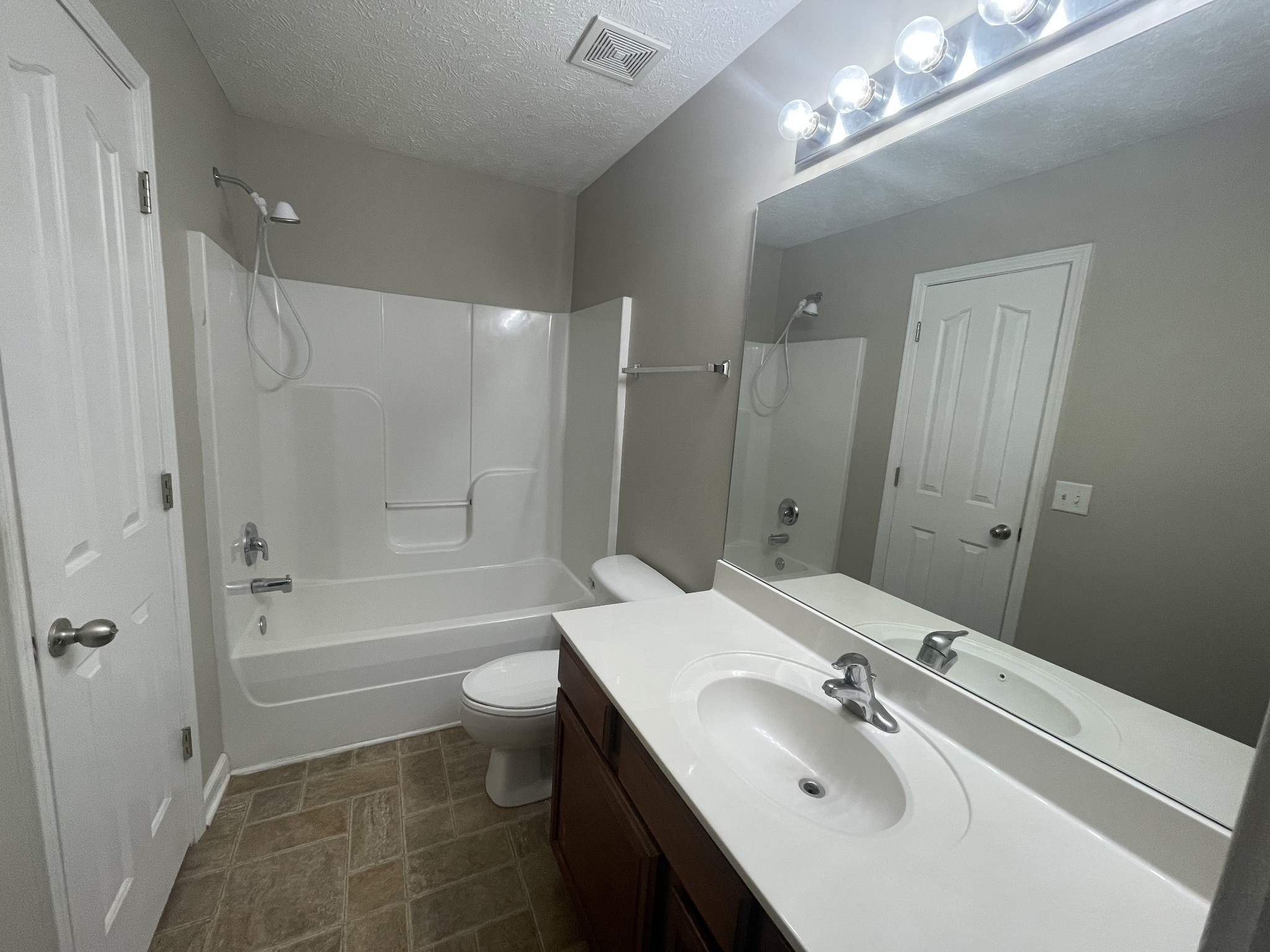 2037 Victory Gallop Lane Murfreesboro, TN 37128 - Photo 13 of 20 a bathroom with a sink a toilet and shower
