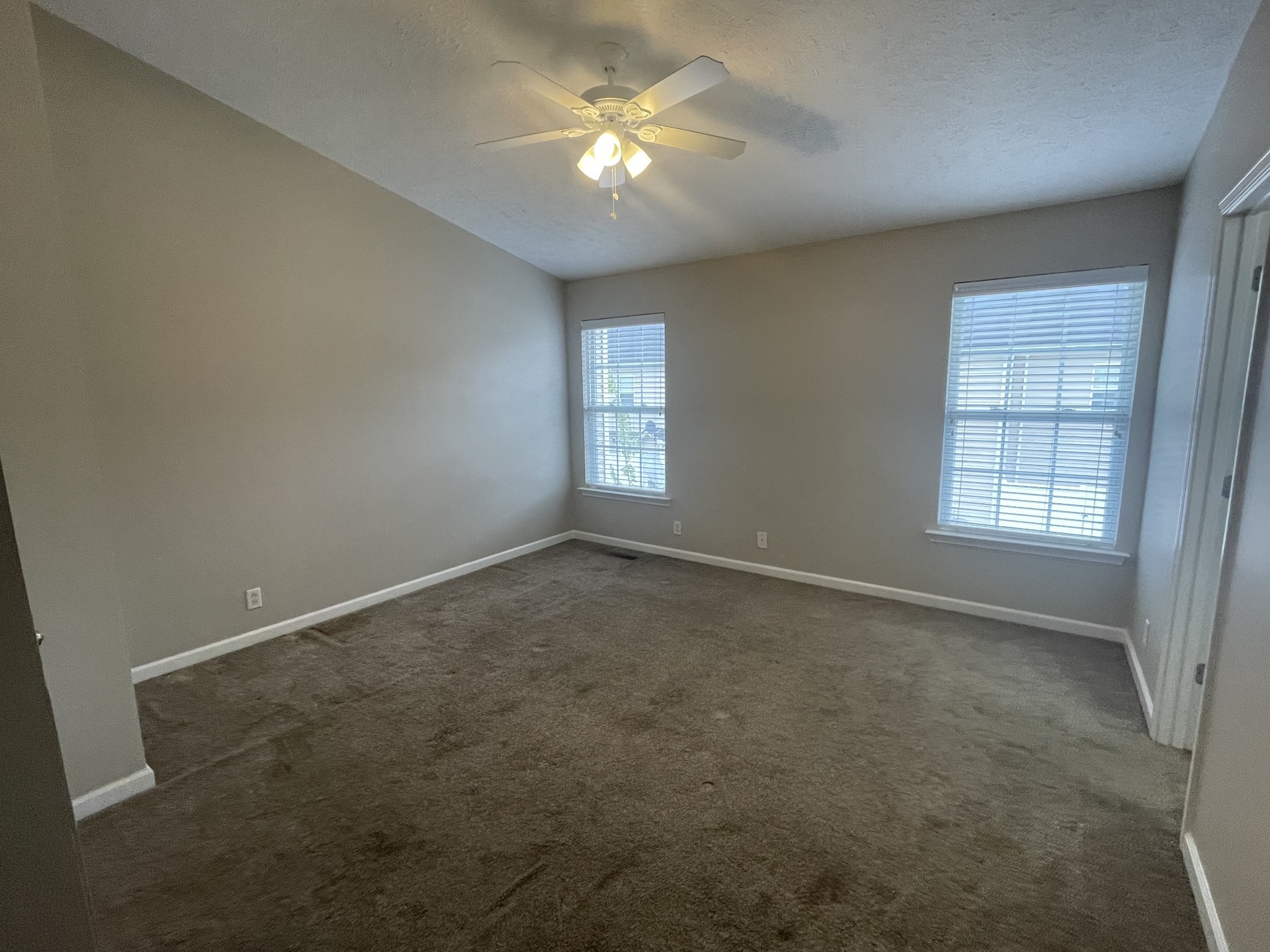 2037 Victory Gallop Lane Murfreesboro, TN 37128 - Photo 14 of 20 an empty room with windows and fan