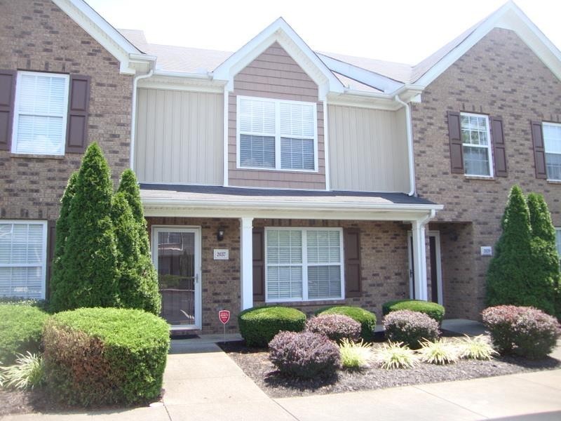 2037 Victory Gallop Lane Murfreesboro, TN 37128 - Photo 2 of 20 a front view of a house with garden and plants