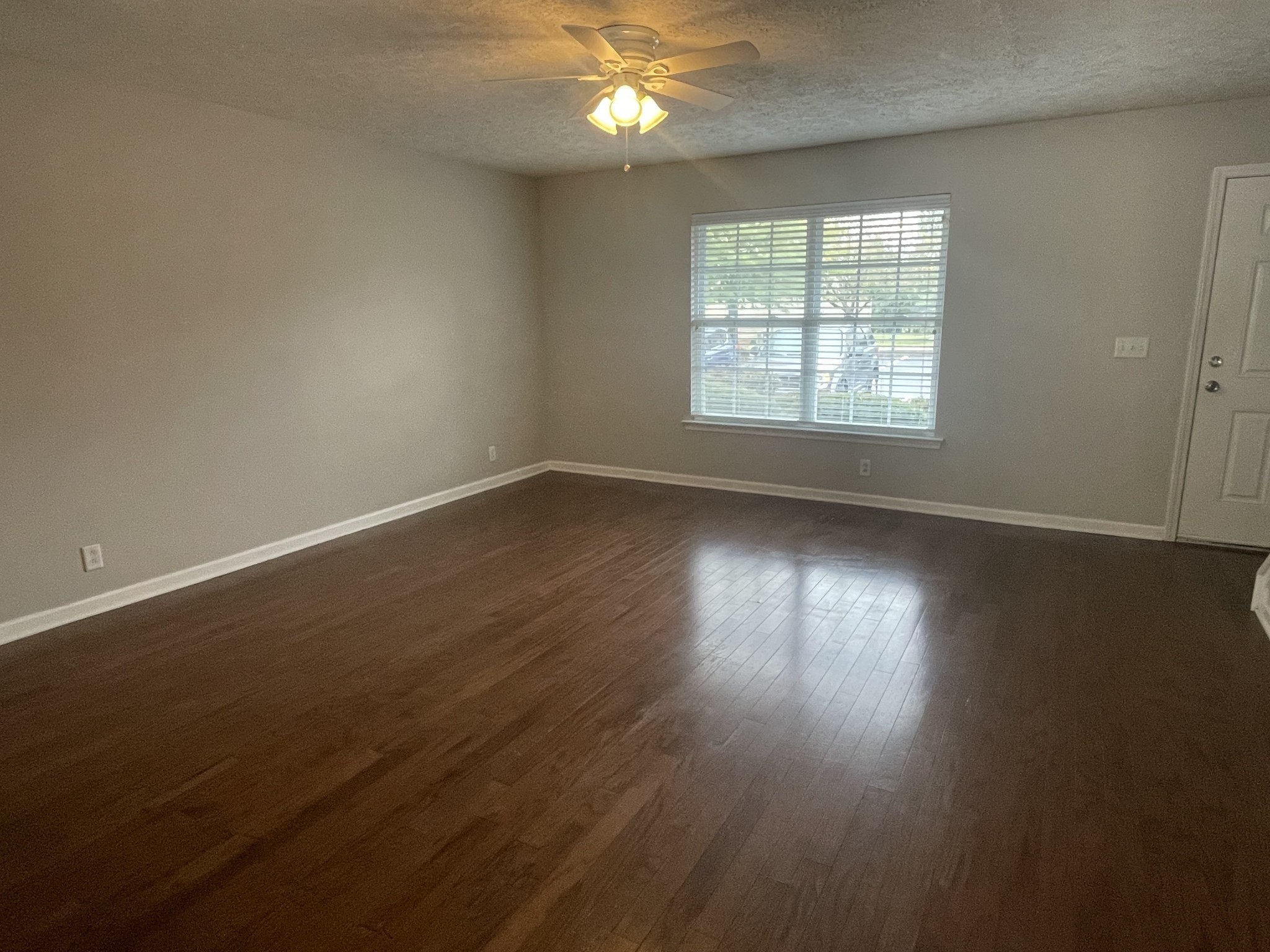 2037 Victory Gallop Lane Murfreesboro, TN 37128 - Photo 3 of 20 an empty room with wooden floor and windows