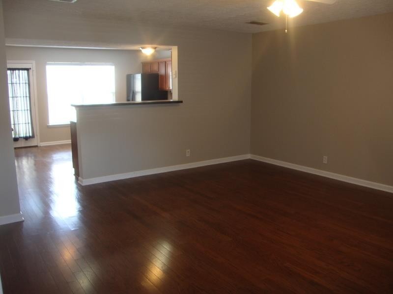2037 Victory Gallop Lane Murfreesboro, TN 37128 - Photo 4 of 20 a view of a room with wooden floor and a window