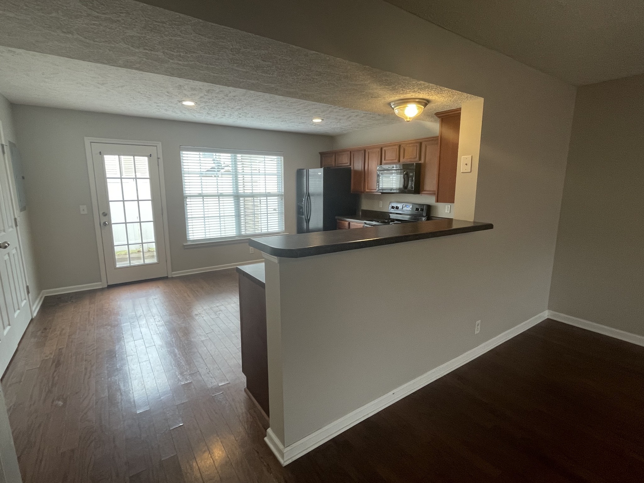 2037 Victory Gallop Lane Murfreesboro, TN 37128 - Photo 5 of 20 a view of a kitchen with a sink wooden floor and a window