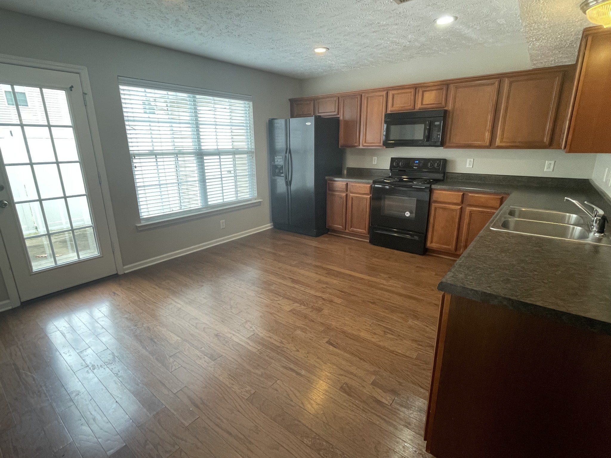 2037 Victory Gallop Lane Murfreesboro, TN 37128 - Photo 6 of 20 a kitchen with stainless steel appliances granite countertop a stove a sink and a refrigerator