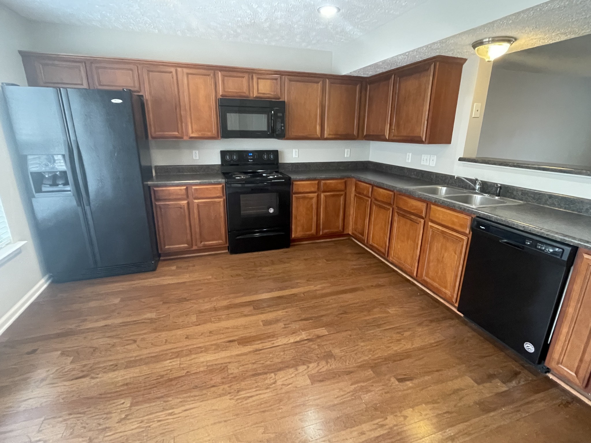 2037 Victory Gallop Lane Murfreesboro, TN 37128 - Photo 7 of 20 a kitchen with stainless steel appliances granite countertop a refrigerator stove top oven and sink