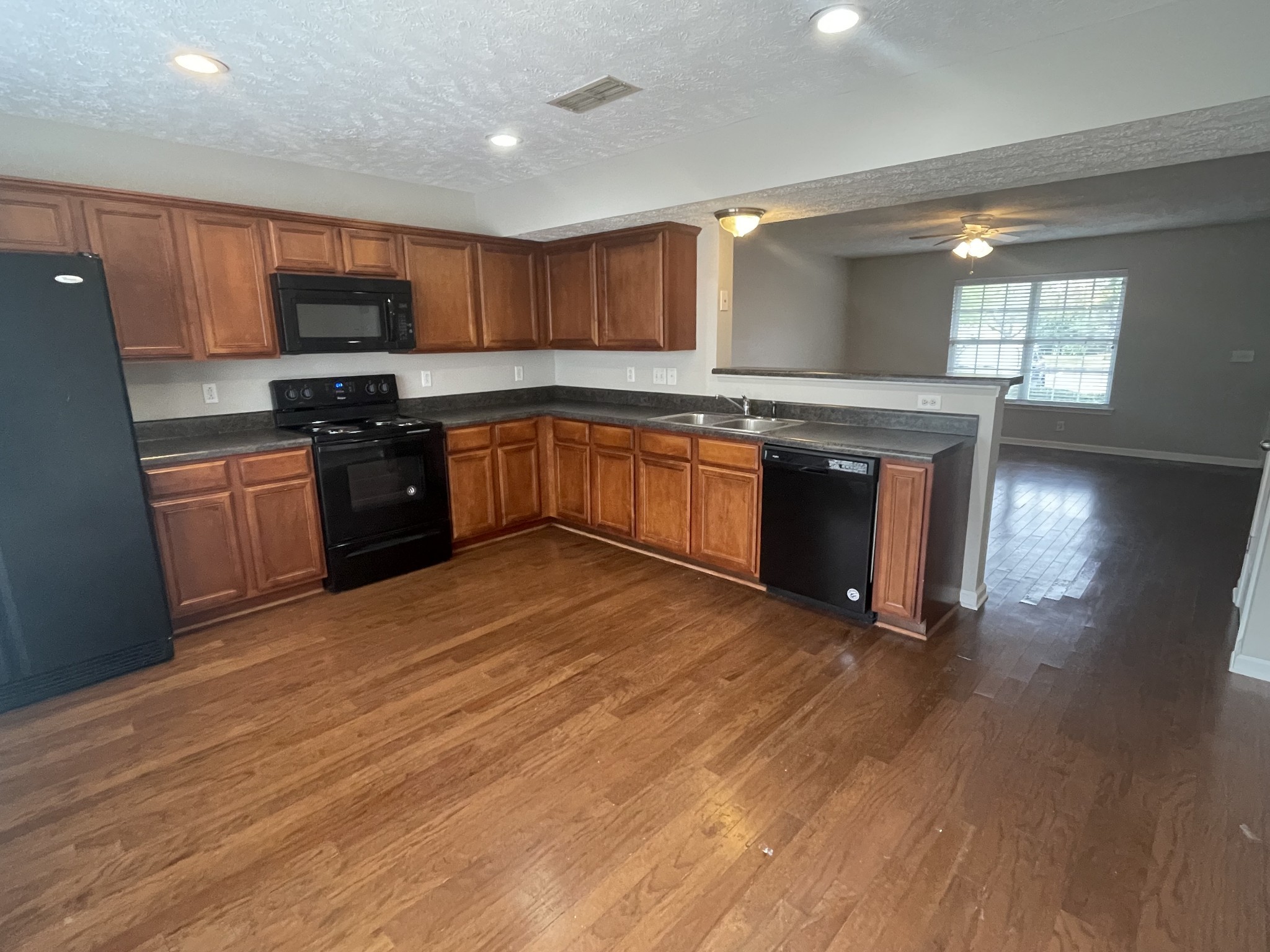 2037 Victory Gallop Lane Murfreesboro, TN 37128 - Photo 8 of 20 a large kitchen with stainless steel appliances granite countertop a stove a sink and a refrigerator