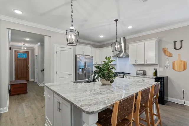 a kitchen with a table and chairs in it