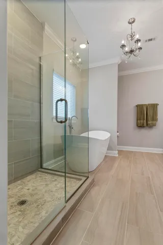 a bathroom with double vanity sinks and a mirror