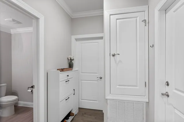 a view of a livingroom with furniture and hardwood floor