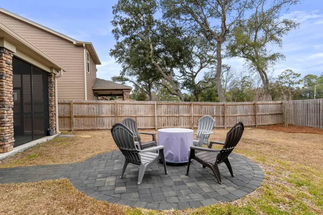 a view of a house with backyard and porch