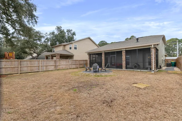 a view of a backyard with sitting area