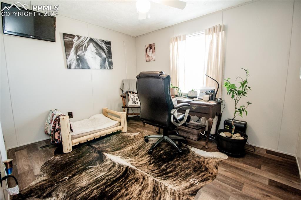 1880 Johnson Road North Rush, CO 80833 - Photo 13 of 40 a living room with furniture and wooden floor