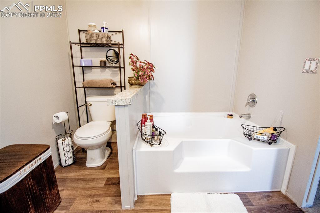 1880 Johnson Road North Rush, CO 80833 - Photo 14 of 40 a bathroom with a sink a toilet and bathtub
