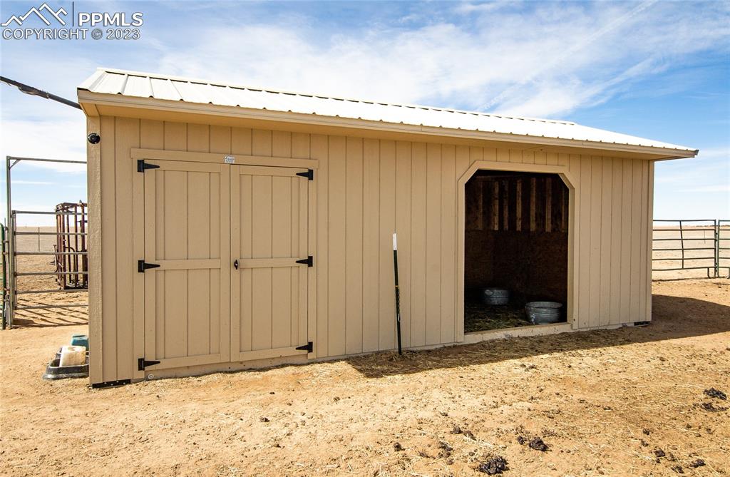 1880 Johnson Road North Rush, CO 80833 - Photo 23 of 40 a view of a front door and a wooden door