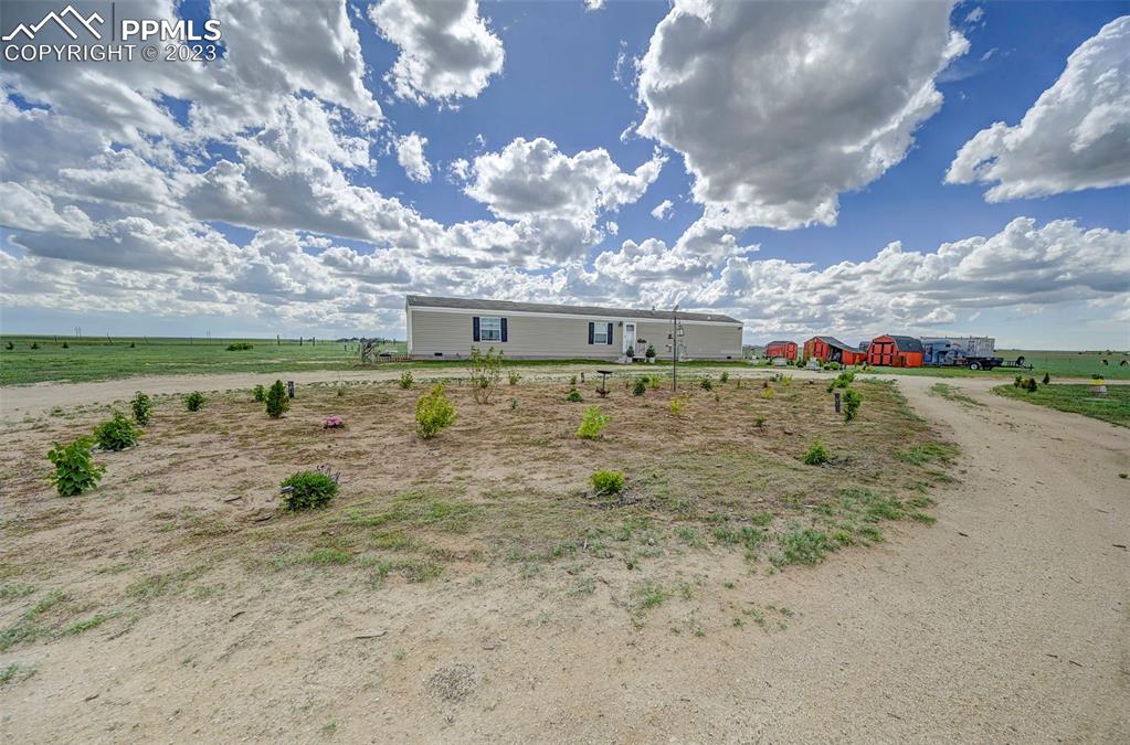 1880 Johnson Road North Rush, CO 80833 - Photo 28 of 40 a view of a big yard with table and chairs