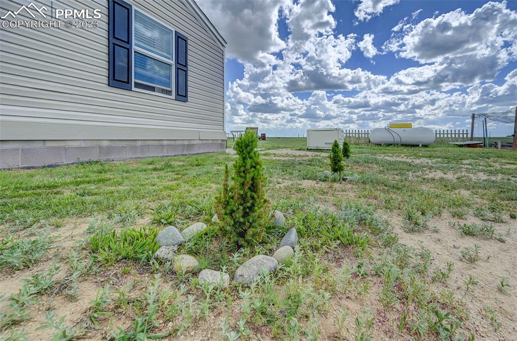1880 Johnson Road North Rush, CO 80833 - Photo 31 of 40 a backyard of a house with lots of green space