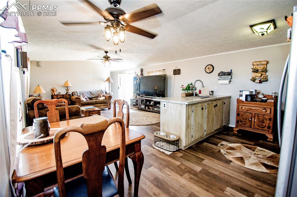 1880 Johnson Road North Rush, CO 80833 - Photo 6 of 40 a living room with furniture and flat screen tv