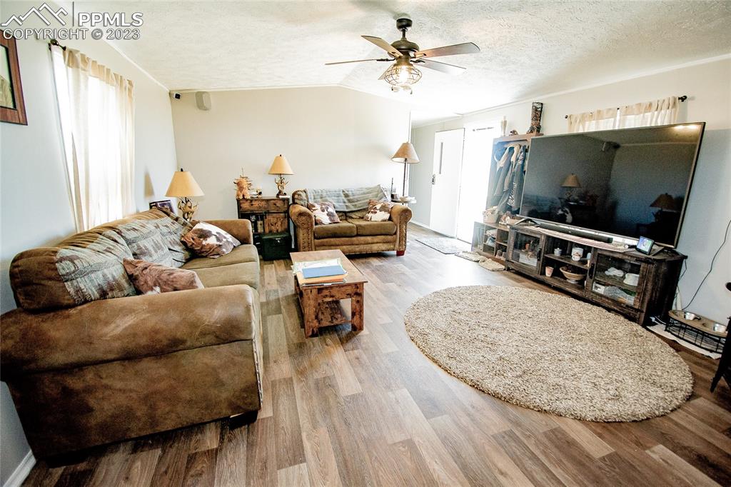 1880 Johnson Road North Rush, CO 80833 - Photo 7 of 40 a living room with furniture and a flat screen tv