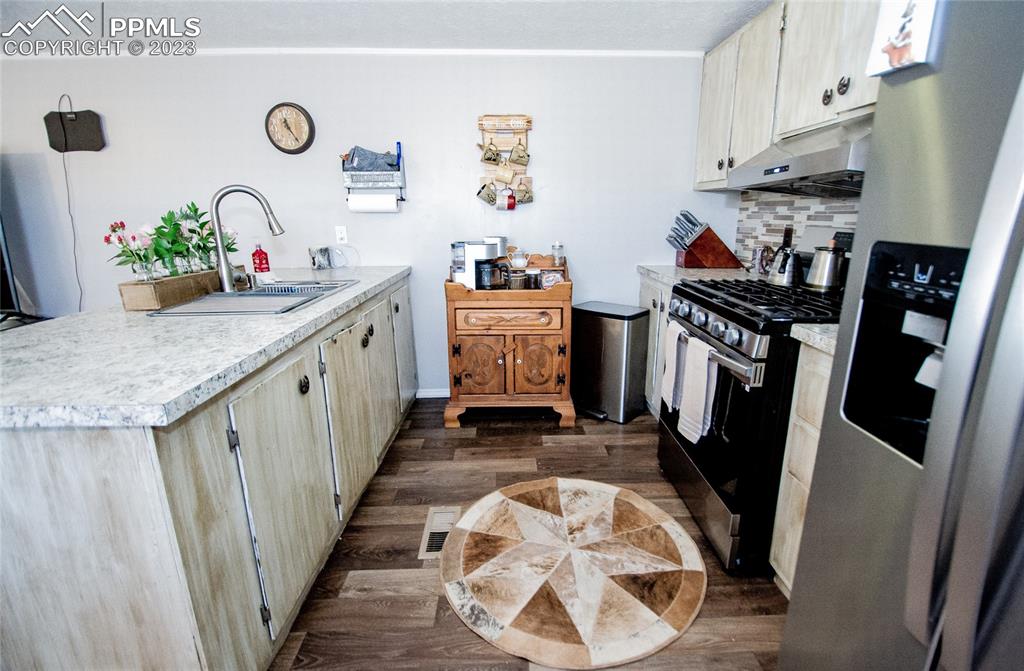 1880 Johnson Road North Rush, CO 80833 - Photo 9 of 40 a kitchen with a sink stove and refrigerator