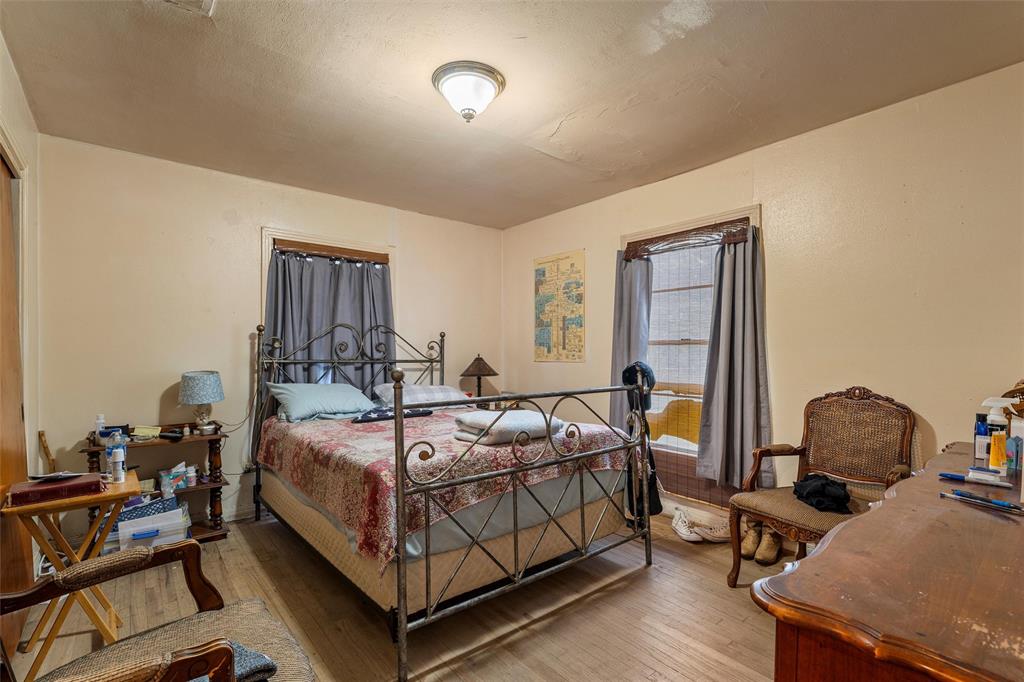 812 Hubert Street Waco, TX 76704 - Photo 10 of 22 a bedroom with a bed chair and the window