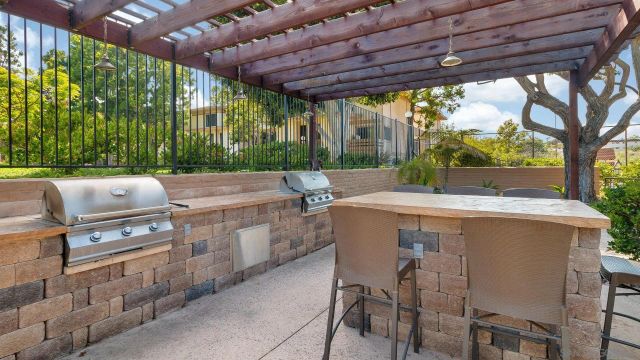 a room with gym equipment and large windows