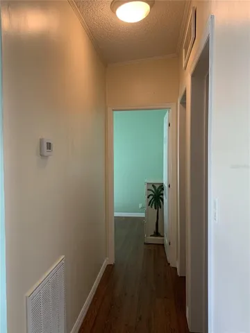 a view of a hallway with a room