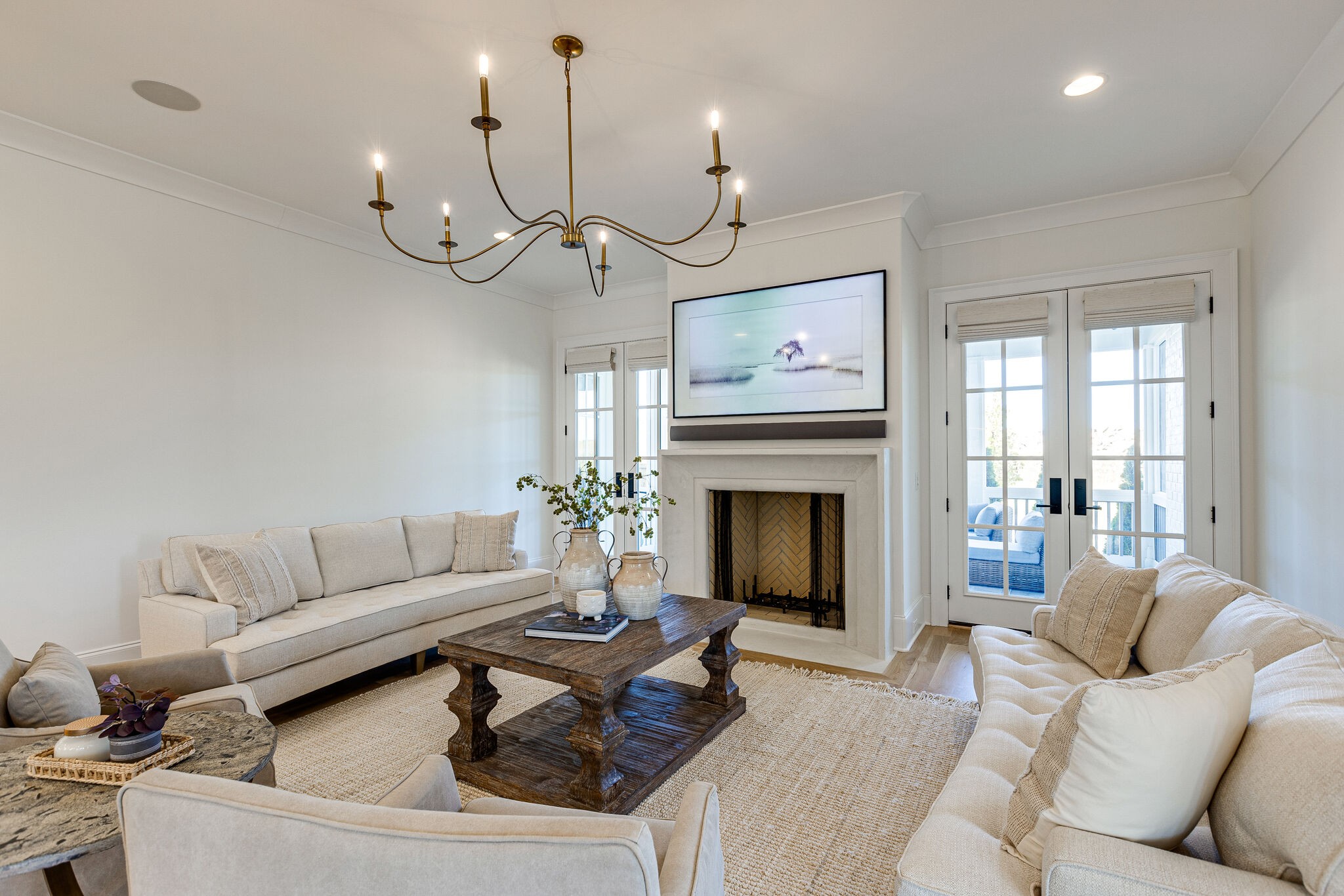 2025 Kathryn Avenue Franklin, TN 37064 - Photo 12 of 69 a living room with furniture a fireplace and a chandelier