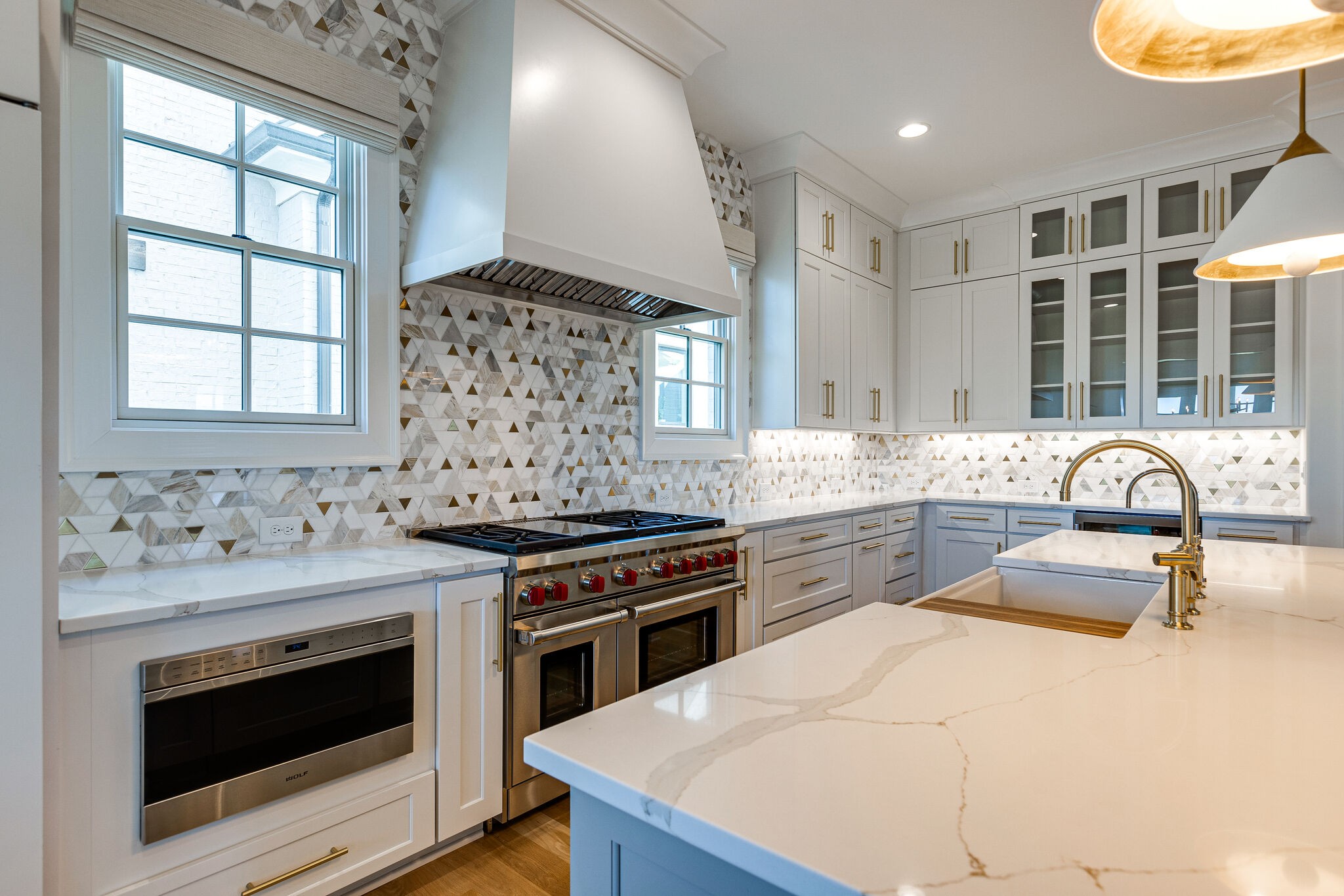 2025 Kathryn Avenue Franklin, TN 37064 - Photo 21 of 69 a kitchen with a stove a sink and a wooden cabinets