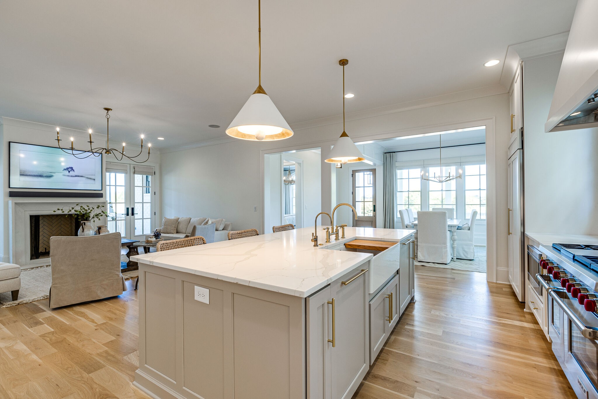 2025 Kathryn Avenue Franklin, TN 37064 - Photo 28 of 69 a large kitchen with kitchen island a stove a sink a center island and a wooden floor