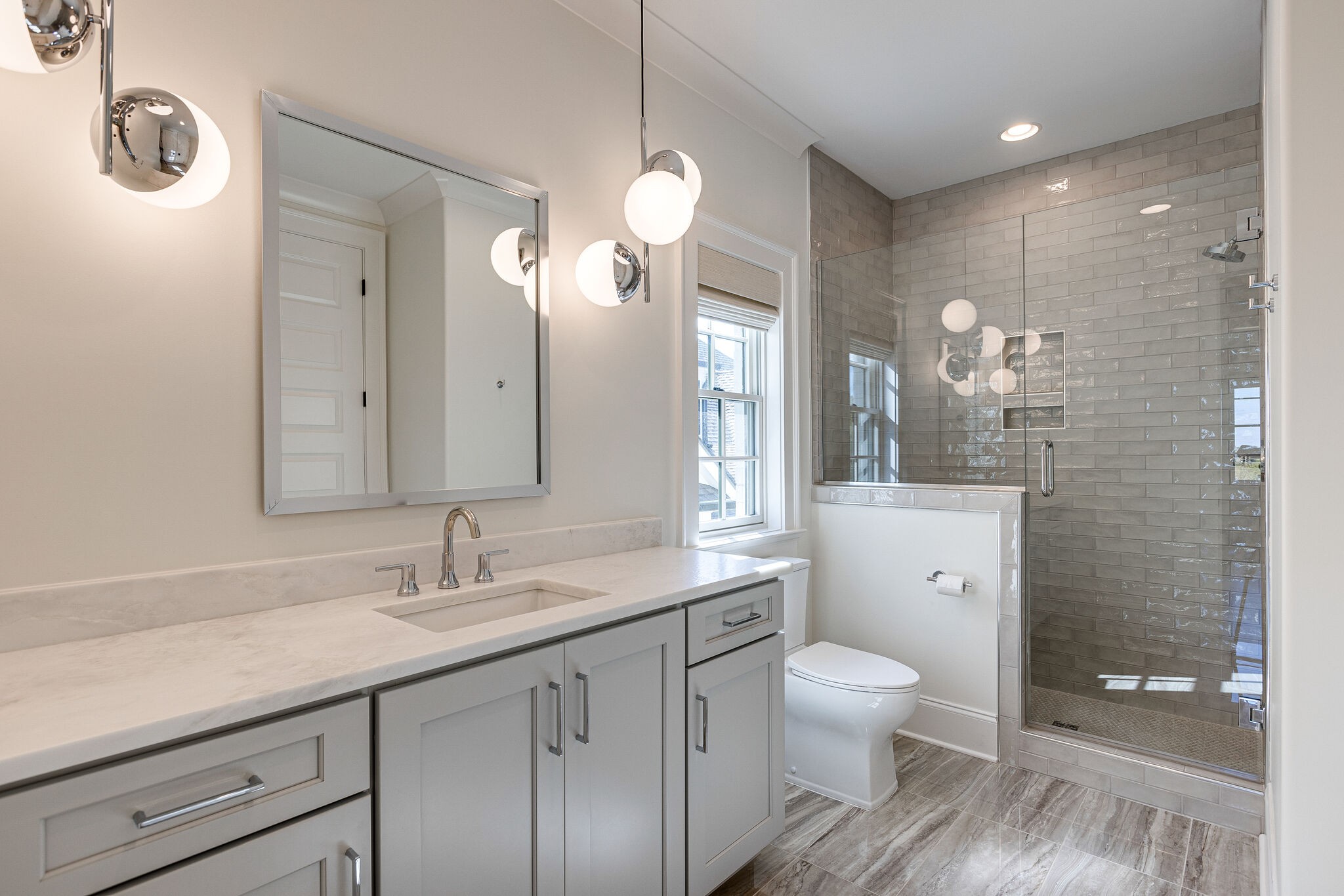 2025 Kathryn Avenue Franklin, TN 37064 - Photo 49 of 69 a bathroom with a toilet a sink and mirror