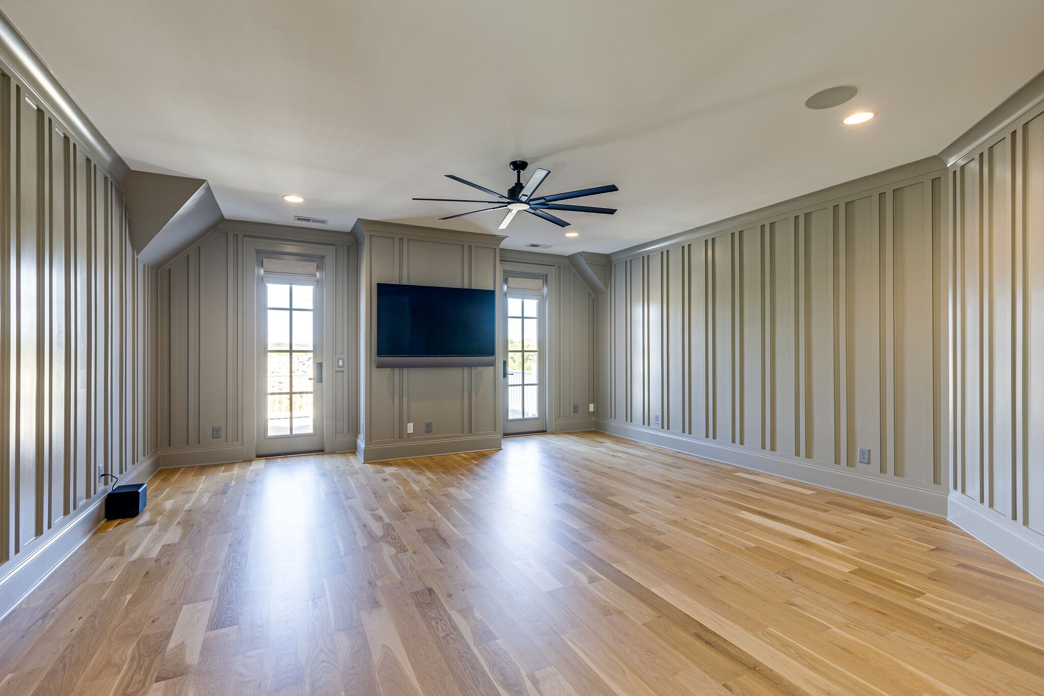 2025 Kathryn Avenue Franklin, TN 37064 - Photo 50 of 69 an empty room with wooden floor a ceiling fan and windows