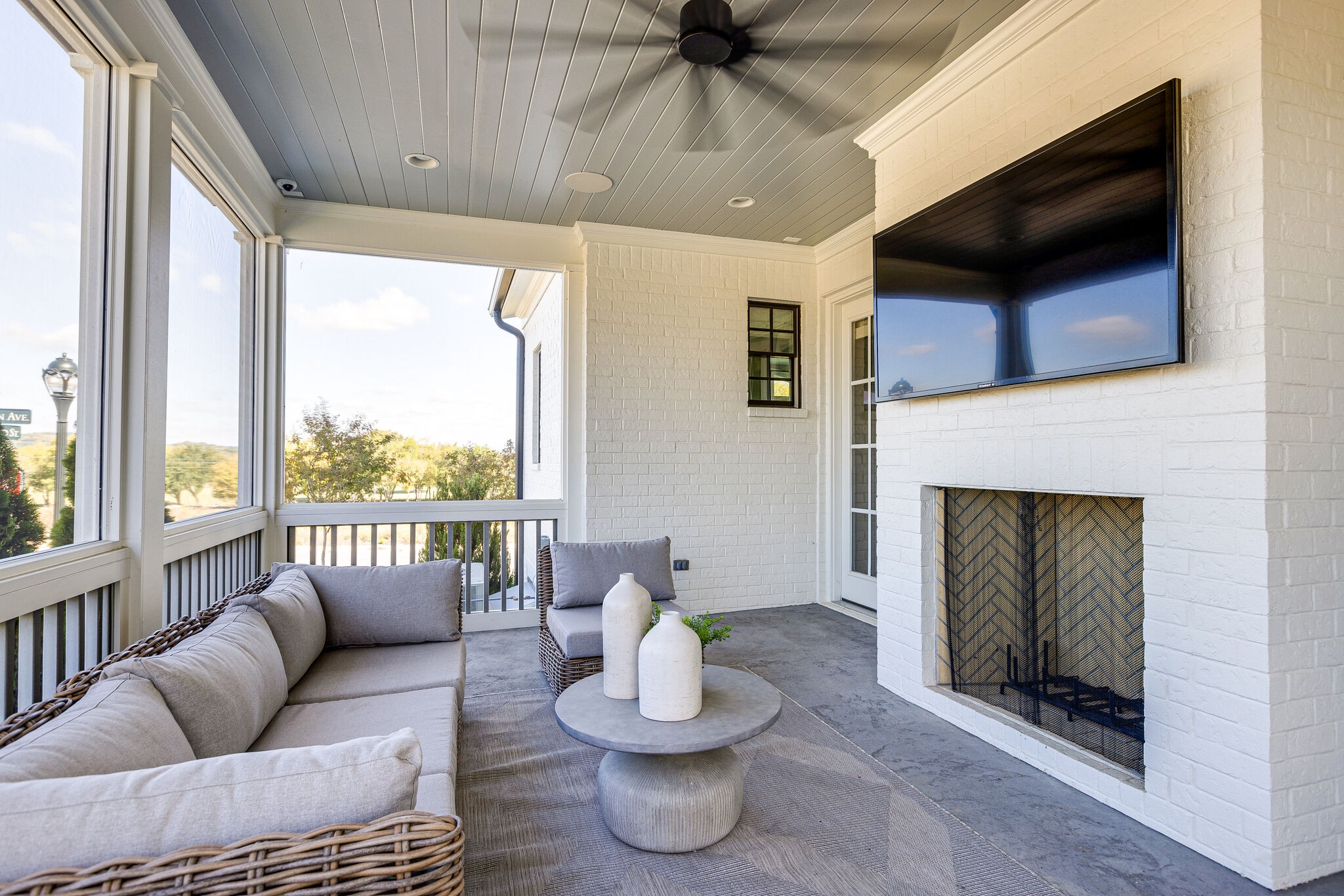 2025 Kathryn Avenue Franklin, TN 37064 - Photo 54 of 69 a living room with furniture a fireplace and a flat screen tv
