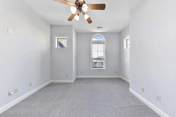 a large kitchen with stainless steel appliances granite countertop a sink and a refrigerator