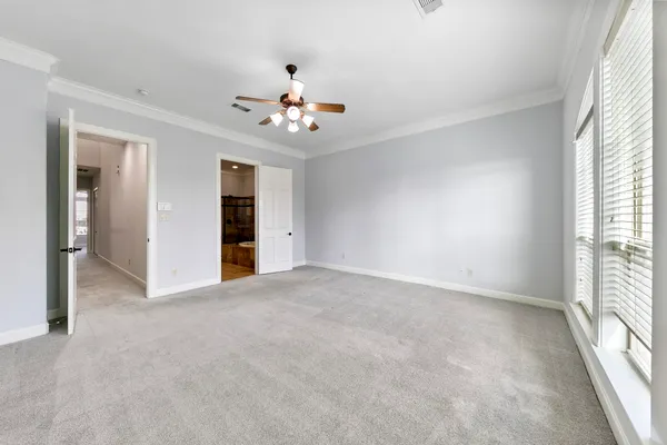 a view of a livingroom with wooden floor and staircase